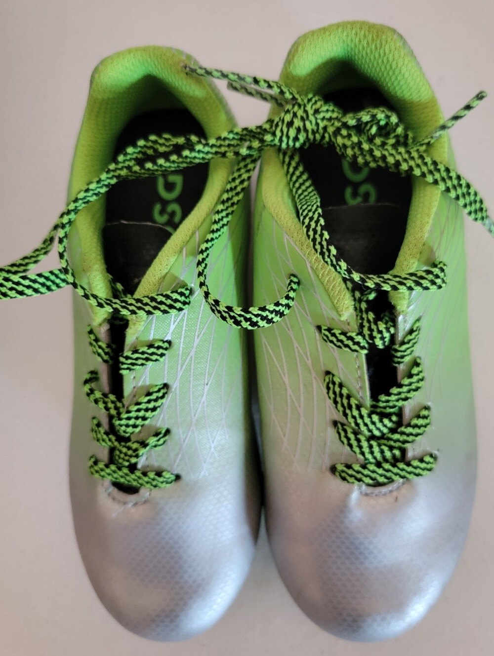 Dick's Sporting Goods Ocala 1.0 Youth Firm Ground Soccer Cleats.